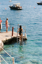 Bella - One-Piece in Black White Dot — entering the water