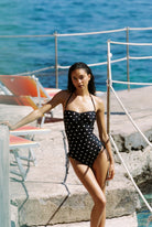 Bella - One-Piece in Black White Dot — front walking view