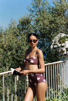 Aura - Bikini in Plum / Pink Polka Dot — front fit view with book