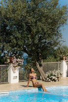 Moro - Bikini in Plum / Soft Pink Polka Dot — wide poolside view with Low Waist Bottom