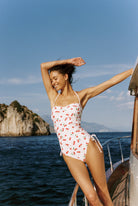 Bella - One-Piece in White Cherry — full front view on boat