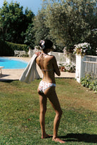 Vita - Bikini in White Cherry — full back view by the pool