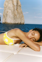 Pear bikini in Yellow, relaxed close view of the pear-print top